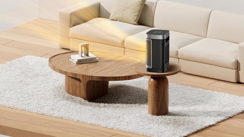 A compact space heater on a coffee table.