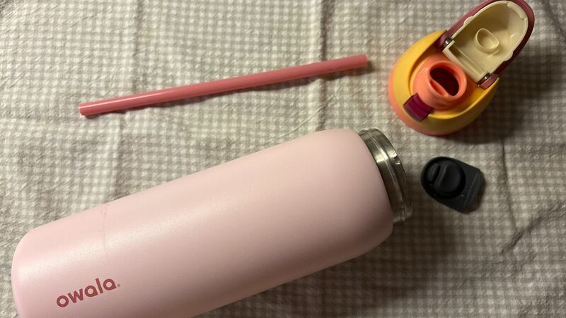 the Owala bottle in pieces on a dish cloth