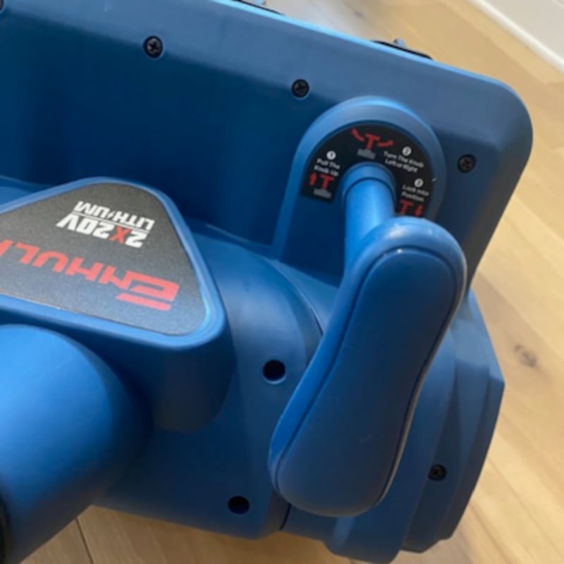 Close up on the snow deflector options of the Enhulk Electric Snow Shovel